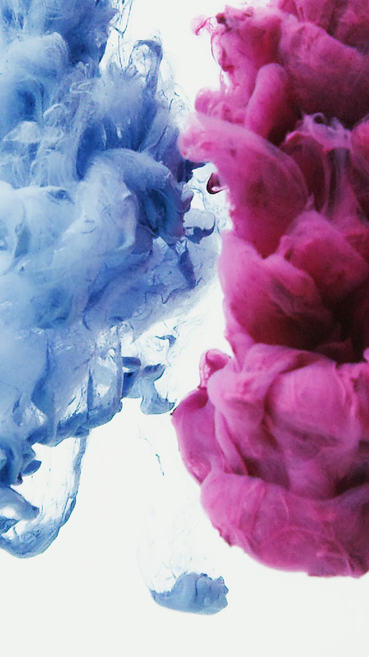 pink and blue paint blended in water